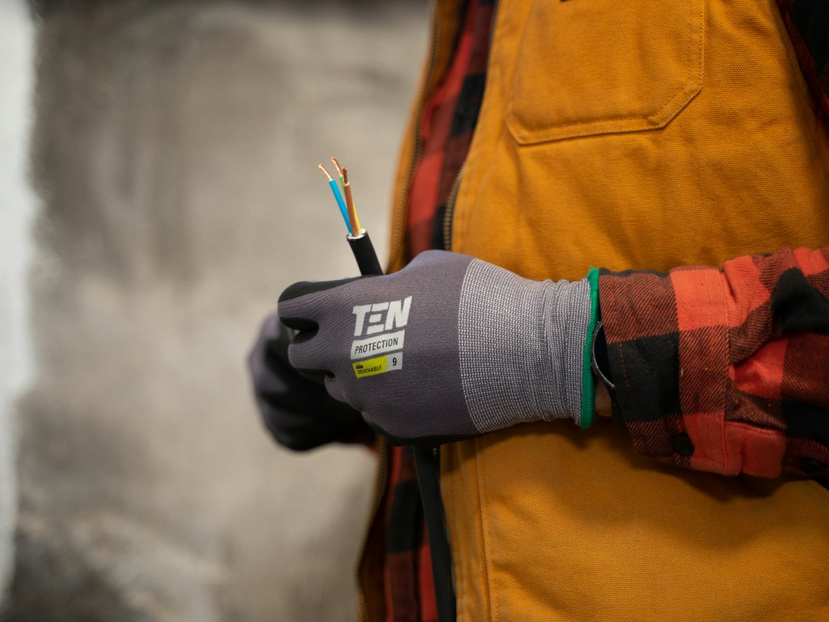 Electrician preparing cable for connection